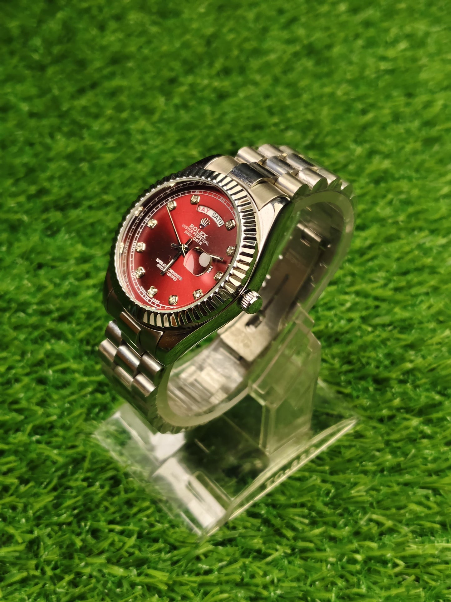 Silver watch with red dial