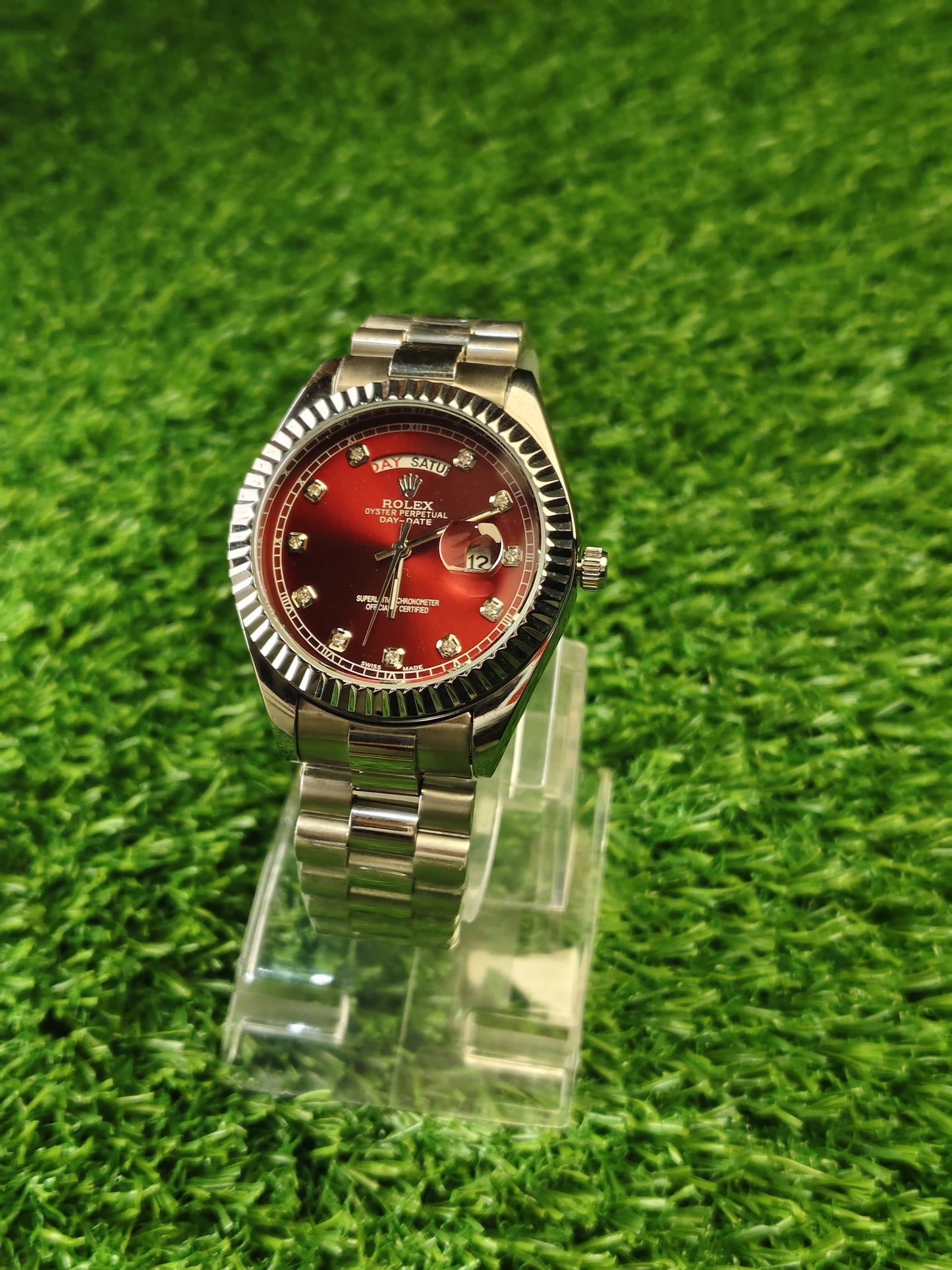 Silver watch with red dial